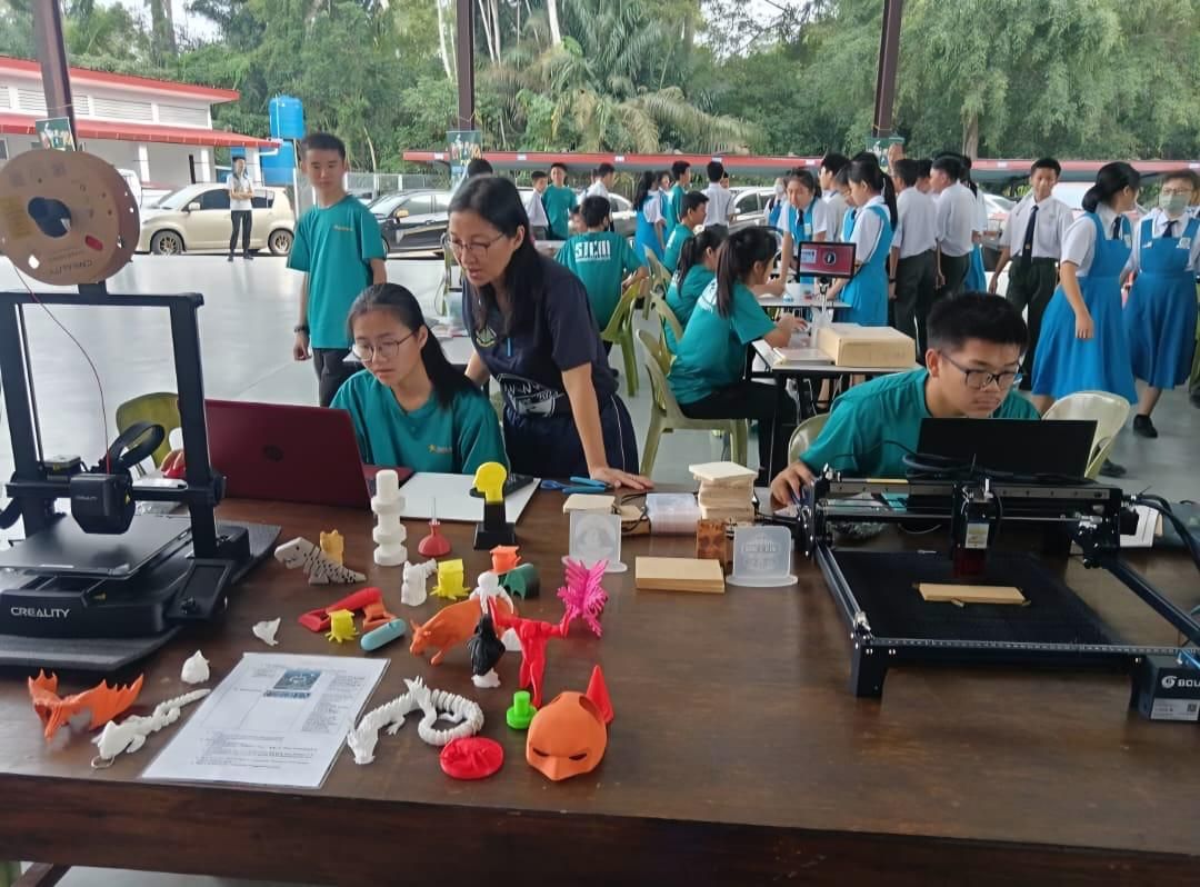 Students showcasing their innovation and tech skills by building circuits and programming.